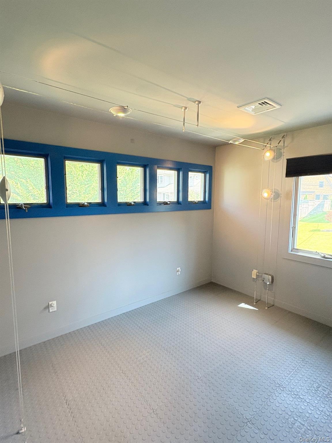 1 Dale Street Rye, NY 10580 - Photo 15 of 28 Another view of bedroom/gym showing row of high windows.