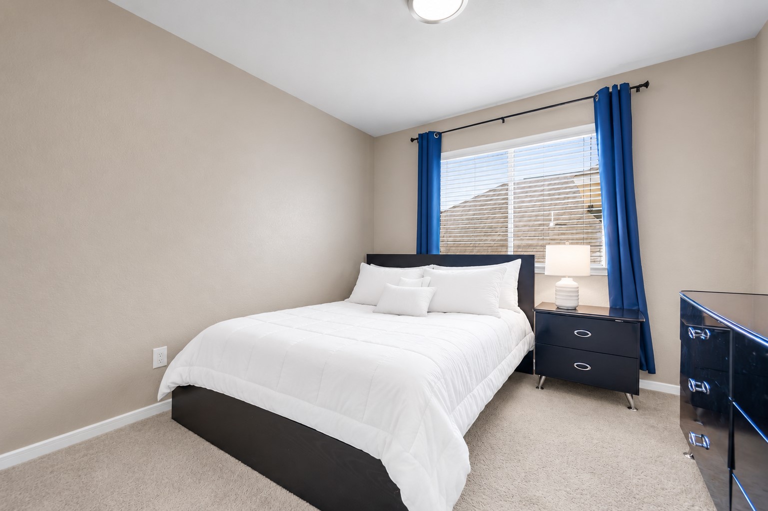 5406 Quarry Ridge Road Richmond, TX 77407 - Photo 29 of 36 Bright upstairs secondary bedroom with abundant natural light, neutral finishes, and spacious layout. Ideal as a guest bedroom, children's room, or private home office, with convenient access to the upstairs full bathroom and game room.