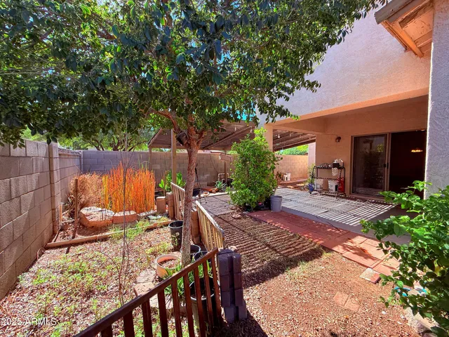 a view of backyard with sitting area