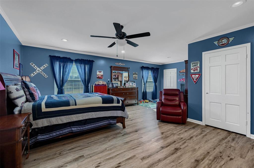 1016 Crestview Drive Sherman, TX 75092 - Photo 11 of 13 a bedroom with furniture and wooden floors