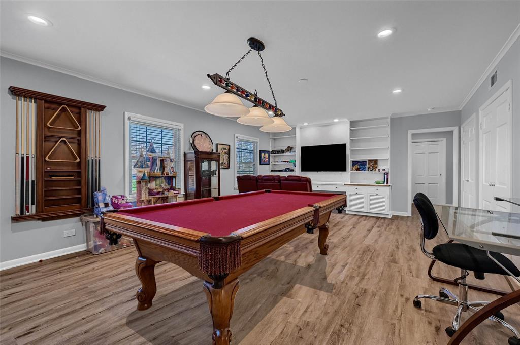 1016 Crestview Drive Sherman, TX 75092 - Photo 10 of 13 a room with furniture pool table gym equipment wooden floor and window
