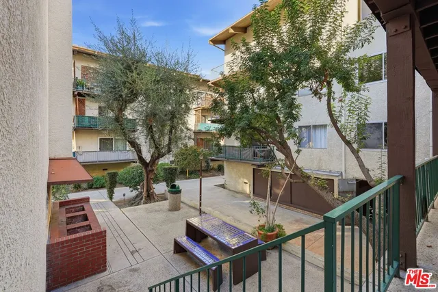 a view of tall building with large windows