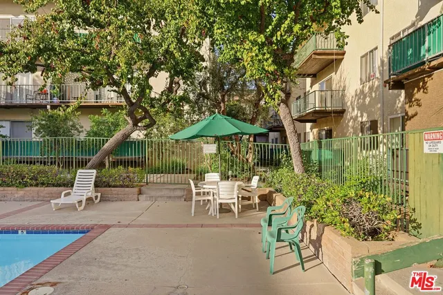 a view of a patio with swimming pool