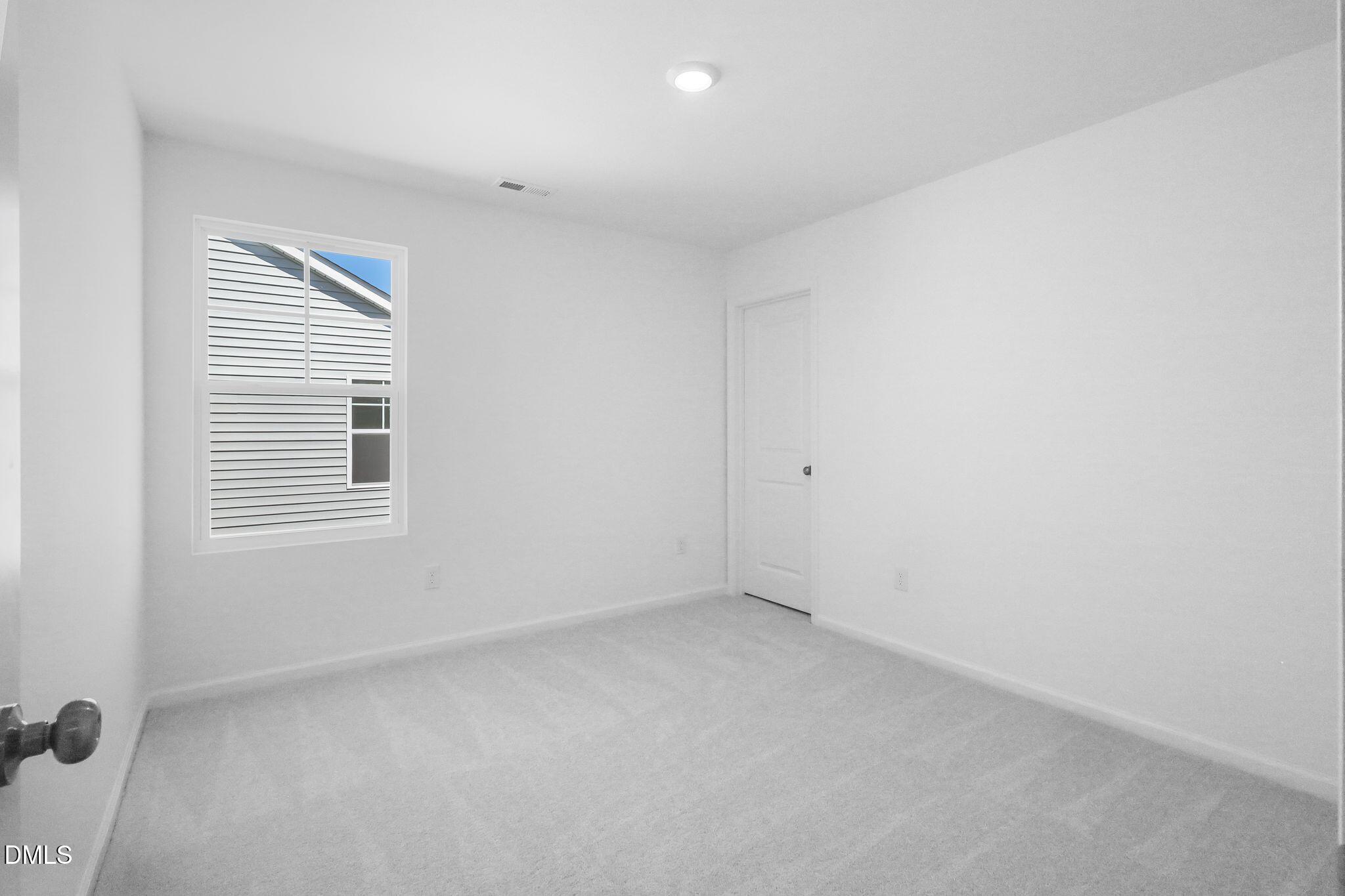 5818 Millstone Way Sims, NC 27880 - Photo 13 of 24 a view of an empty room with a window