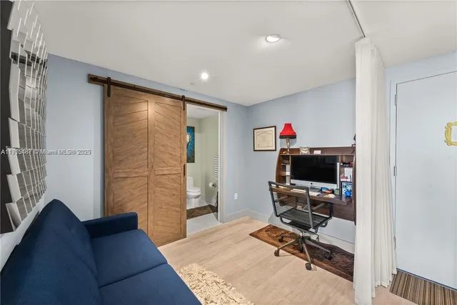 a workspace with furniture and a gate