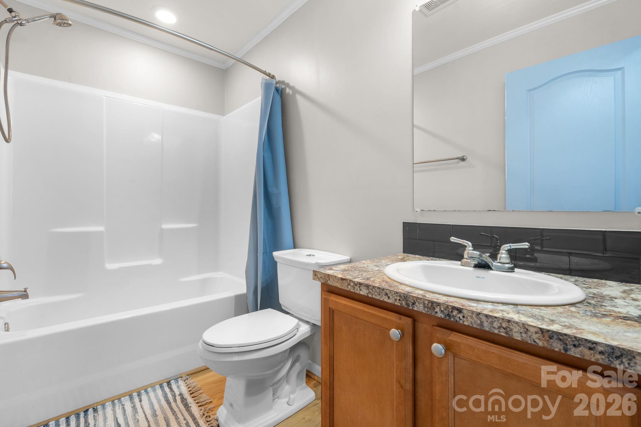 999 Stone Throw Drive Concord, NC 28025 - Photo 18 of 23 a bathroom with a granite countertop sink toilet and shower
