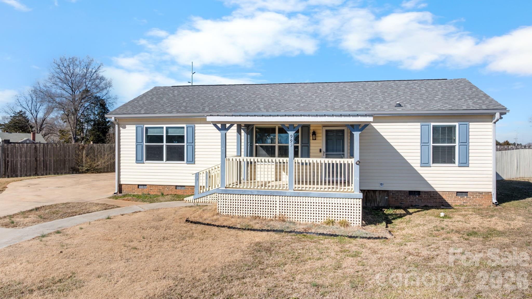 999 Stone Throw Drive Concord, NC 28025 - Photo 2 of 23 a front view of a house with a yard