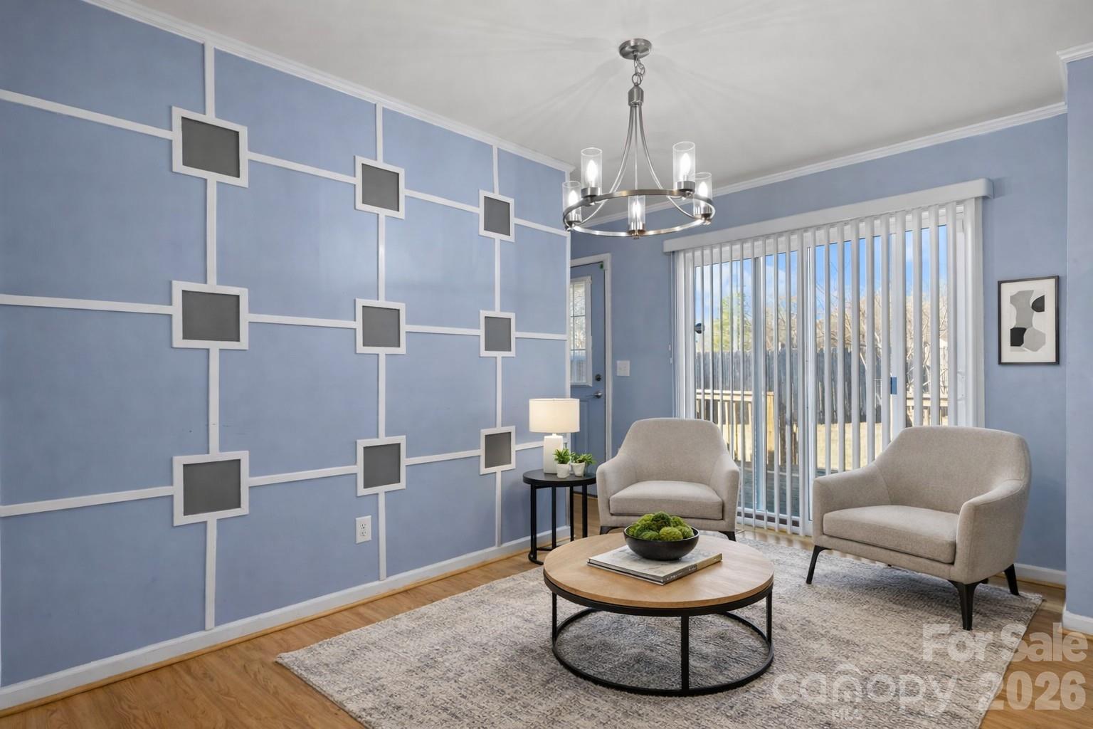 999 Stone Throw Drive Concord, NC 28025 - Photo 7 of 23 a living room with furniture and a chandelier
