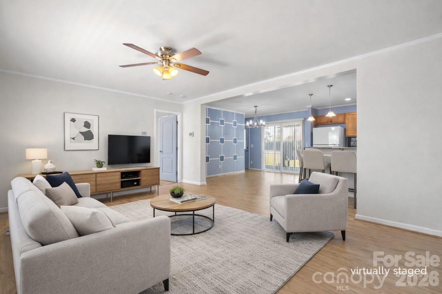 999 Stone Throw Drive Concord, NC 28025 - Photo 9 of 23 a living room with furniture and a flat screen tv