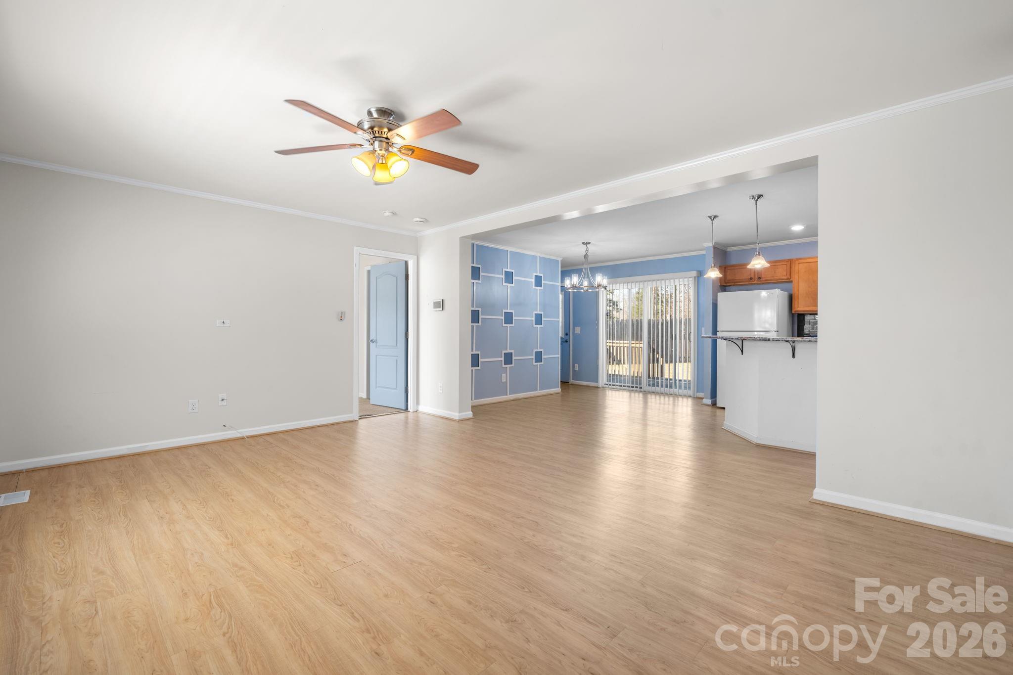 999 Stone Throw Drive Concord, NC 28025 - Photo 10 of 23 a view of empty room with wooden floor and windows