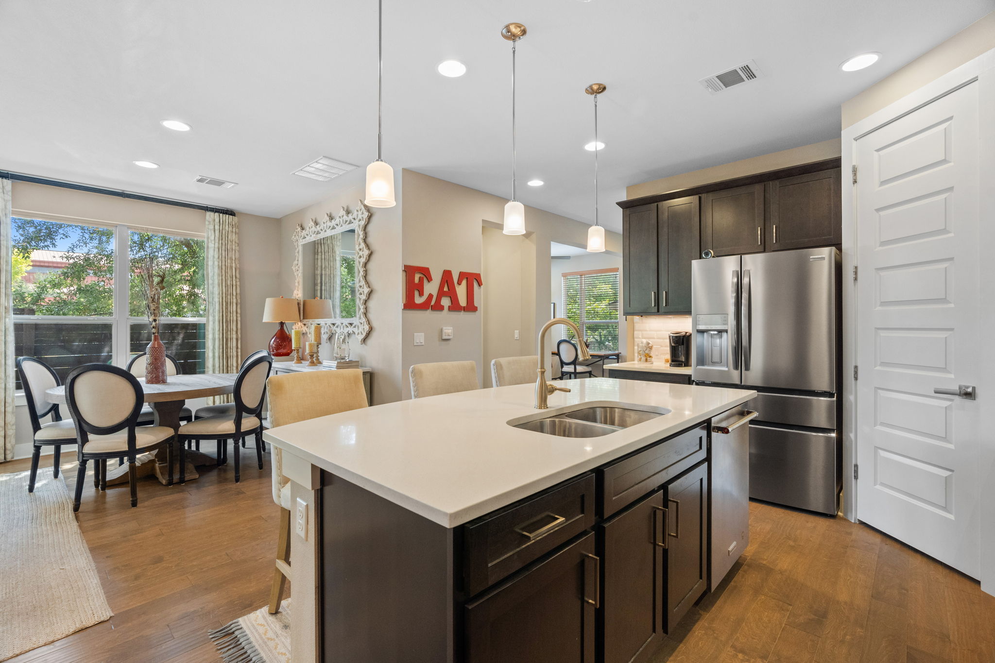 3707 Birch Street, Unit B Austin, TX 78704 - Photo 12 of 40 There are two dining options: the family dining breakfast bar and the more formal dining area behind.