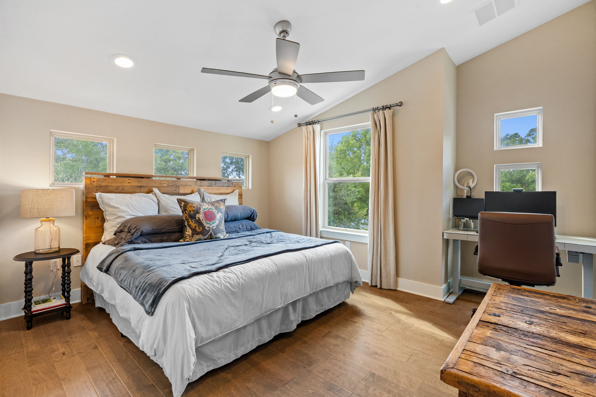 3707 Birch Street, Unit B Austin, TX 78704 - Photo 30 of 40 Upstairs secondary bedroom with hardwood floors, walk in closet recessed lighting, a nook for a desk, lofted ceiling, and ceiling fan.