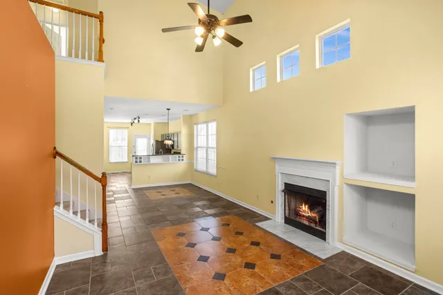 a view of an empty room and fire place
