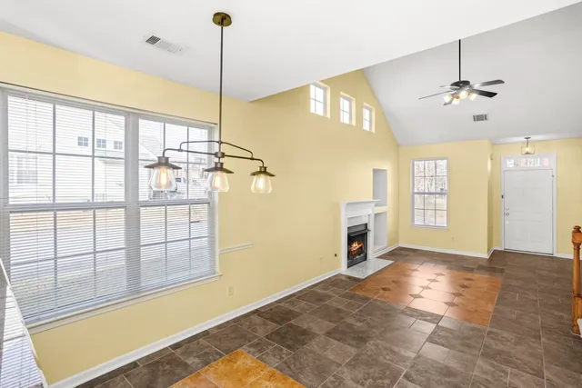 a view of a room with cabinet and windows