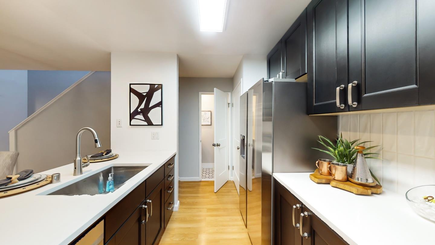 2201 The Alameda, Unit 27 Santa Clara, CA 95050 - Photo 11 of 25 a kitchen with stainless steel appliances a sink stove and cabinets