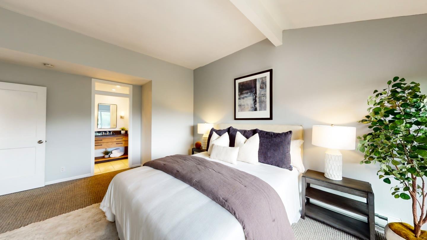 2201 The Alameda, Unit 27 Santa Clara, CA 95050 - Photo 15 of 25 a bedroom with a bed and a potted plant