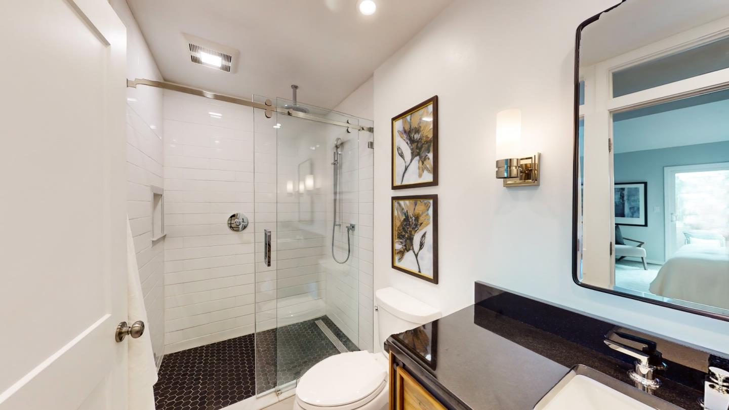 2201 The Alameda, Unit 27 Santa Clara, CA 95050 - Photo 17 of 25 a bathroom with a sink a toilet a shower and a mirror