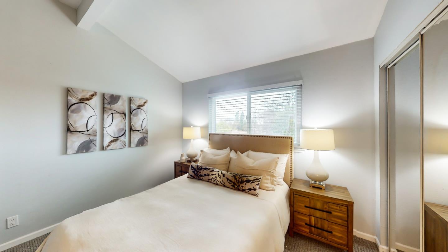 2201 The Alameda, Unit 27 Santa Clara, CA 95050 - Photo 19 of 25 a bedroom with a bed and wooden floor