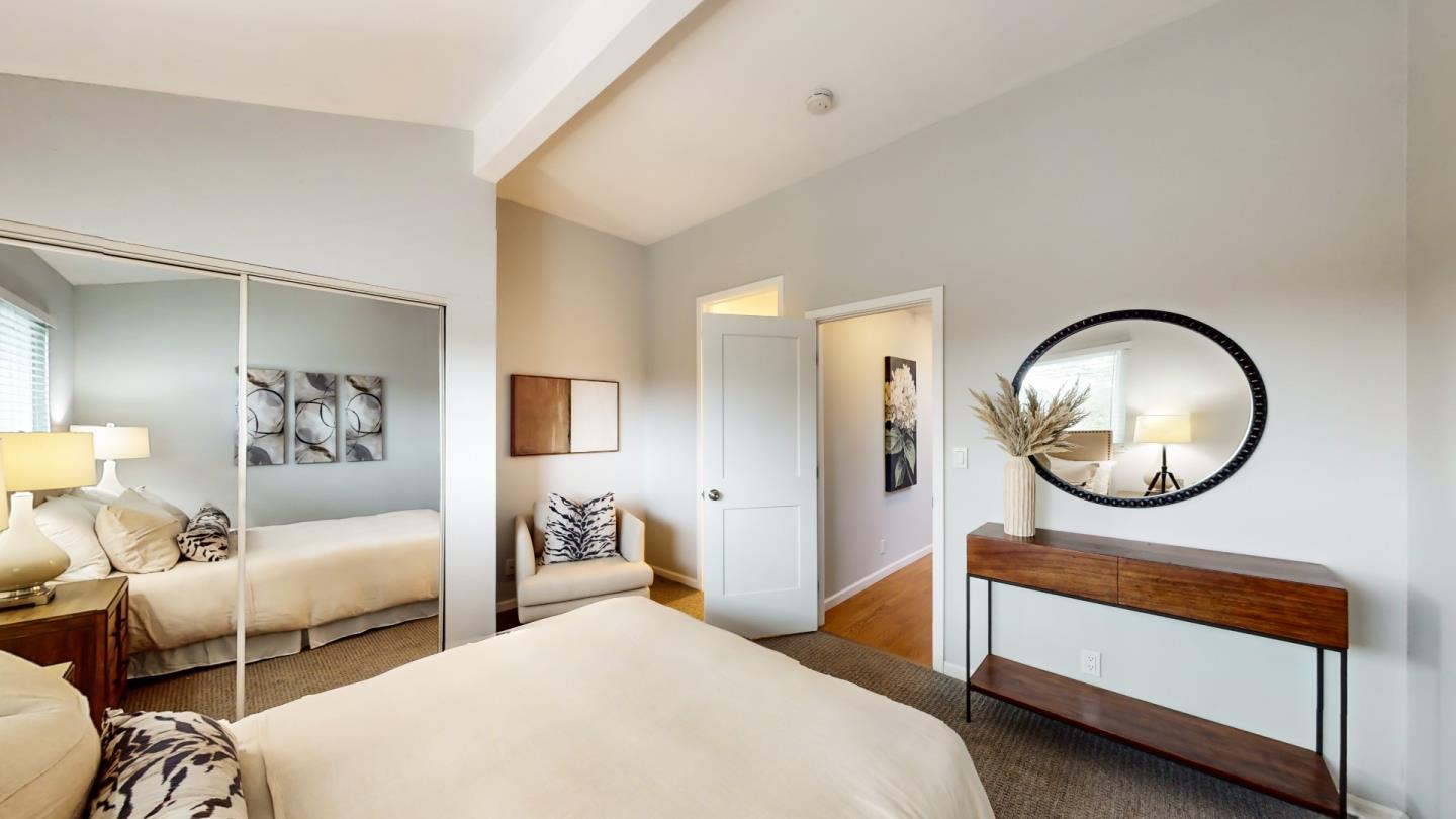 2201 The Alameda, Unit 27 Santa Clara, CA 95050 - Photo 20 of 25 a bedroom with bed and a chandelier