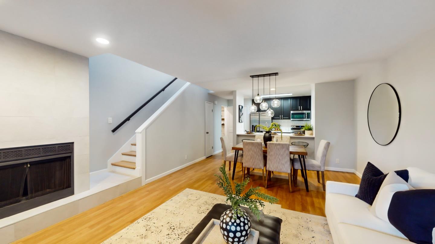 2201 The Alameda, Unit 27 Santa Clara, CA 95050 - Photo 2 of 25 a living room with dining room and wooden floor