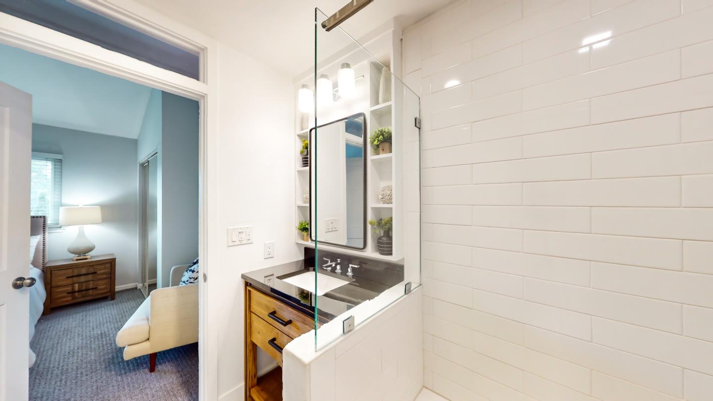 2201 The Alameda, Unit 27 Santa Clara, CA 95050 - Photo 23 of 25 a en suite bathroom with a sink and a mirror
