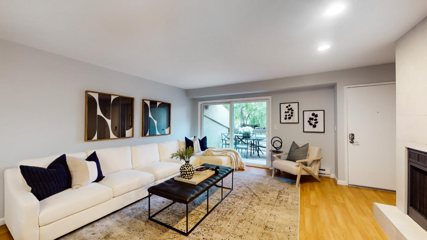 2201 The Alameda, Unit 27 Santa Clara, CA 95050 - Photo 4 of 25 a living room with furniture and a wooden floor