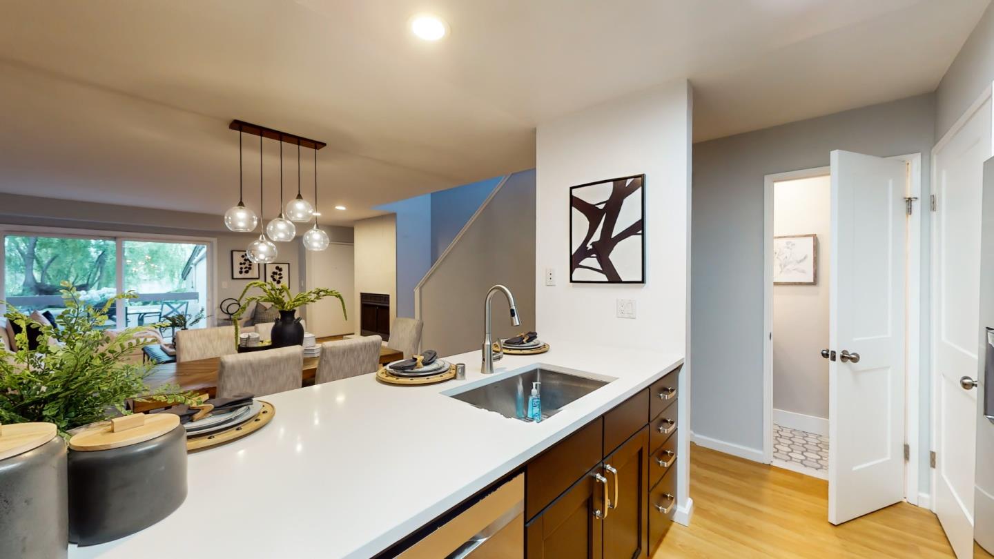 2201 The Alameda, Unit 27 Santa Clara, CA 95050 - Photo 10 of 25 a kitchen with a sink and a refrigerator