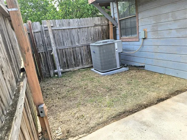a view of outdoor space with wooden fence