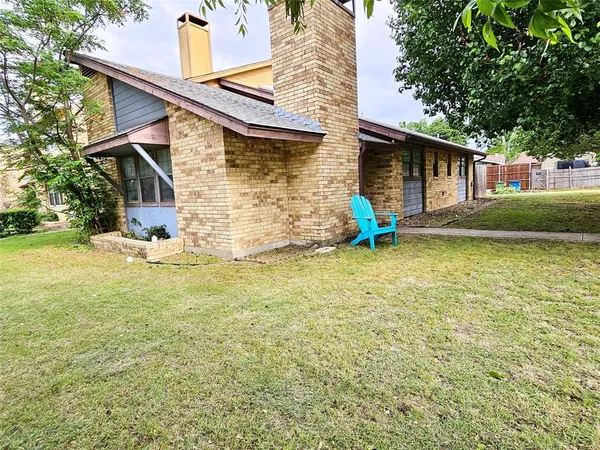 a view of a house with pool and a yard