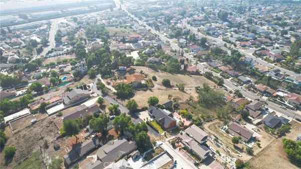 a bedroom with a bed and a ceiling fan in it