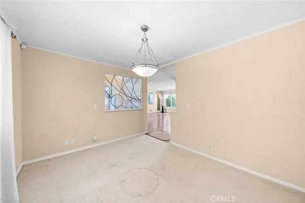 a view of empty room with windows