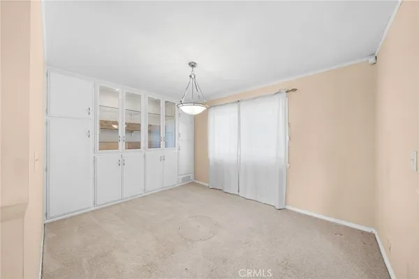 a very nice looking dining room with furniture and a window