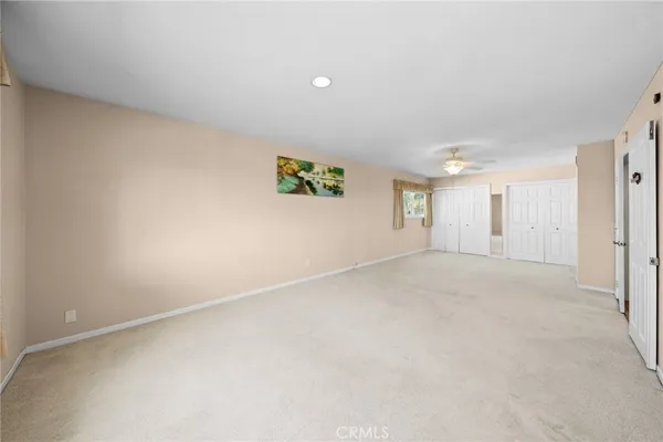a view of balcony with wooden floor