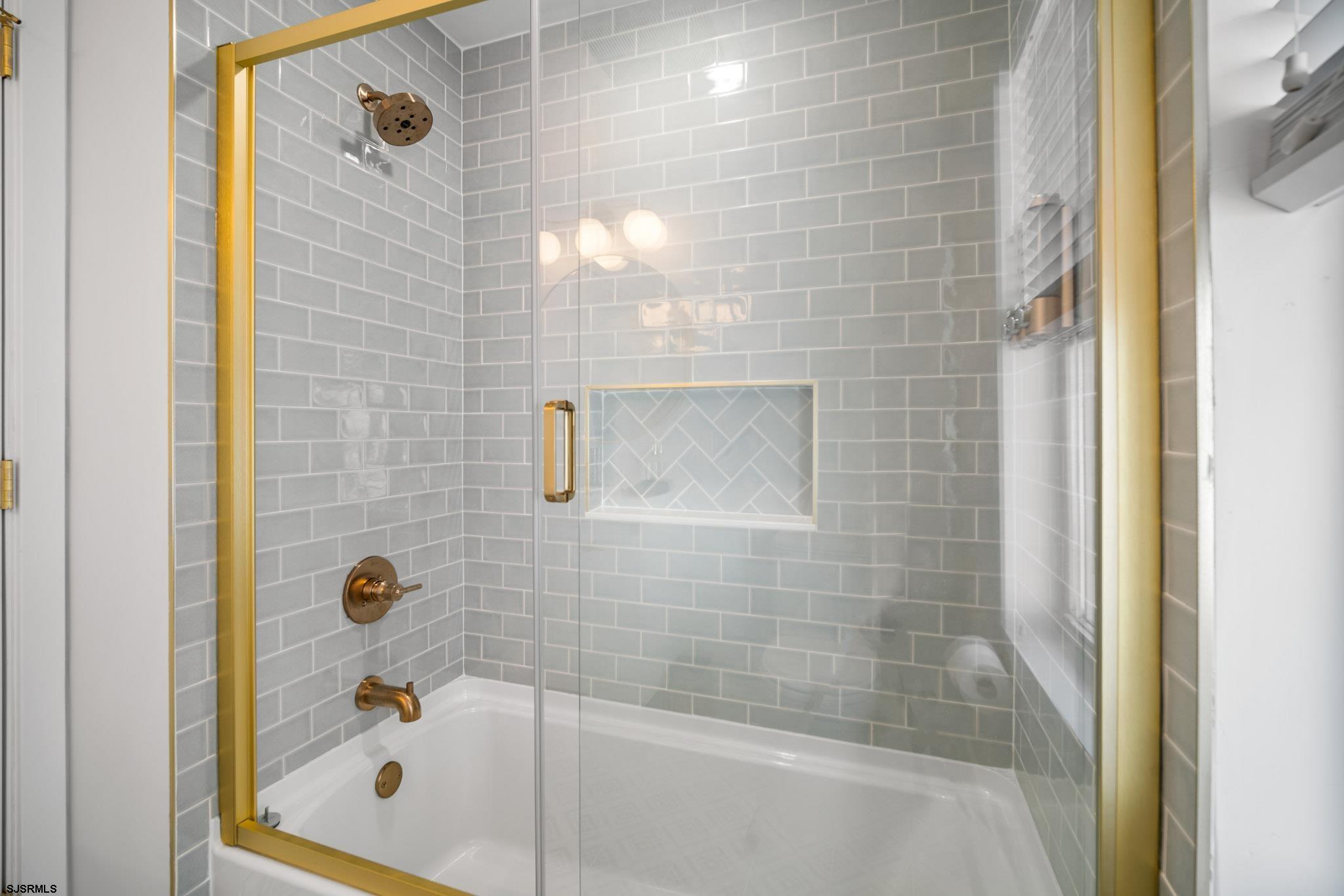 1059 Asbury Avenue, Unit 2 Ocean City, NJ 08226 - Photo 10 of 14 a bathroom with a shower