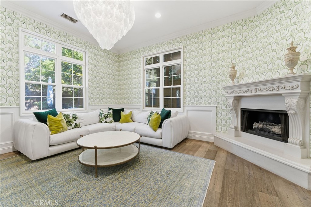 27 Gardenpath Irvine, CA 92603 - Photo 12 of 34 a living room with furniture and a fireplace