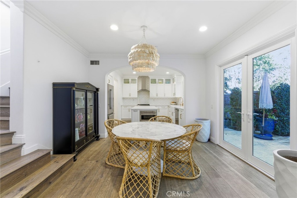 27 Gardenpath Irvine, CA 92603 - Photo 13 of 34 a view of a dining room with furniture window and wooden floor
