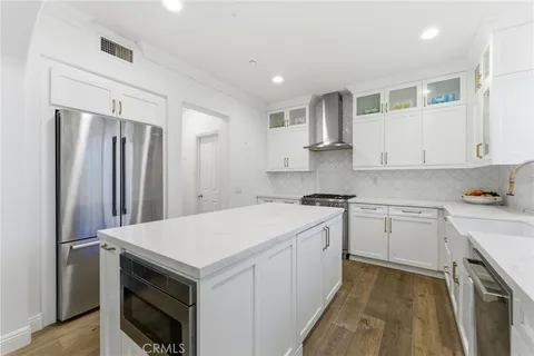 a kitchen with a stove sink and refrigerator