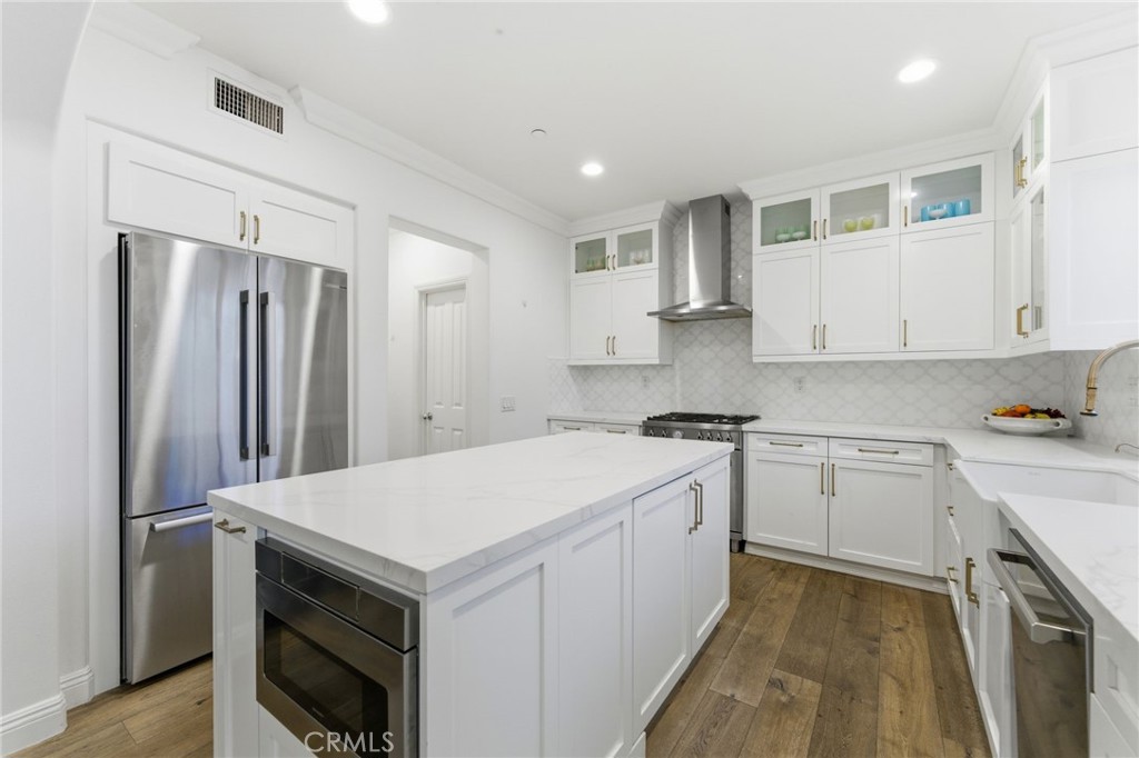 27 Gardenpath Irvine, CA 92603 - Photo 15 of 34 a kitchen with a stove sink and refrigerator