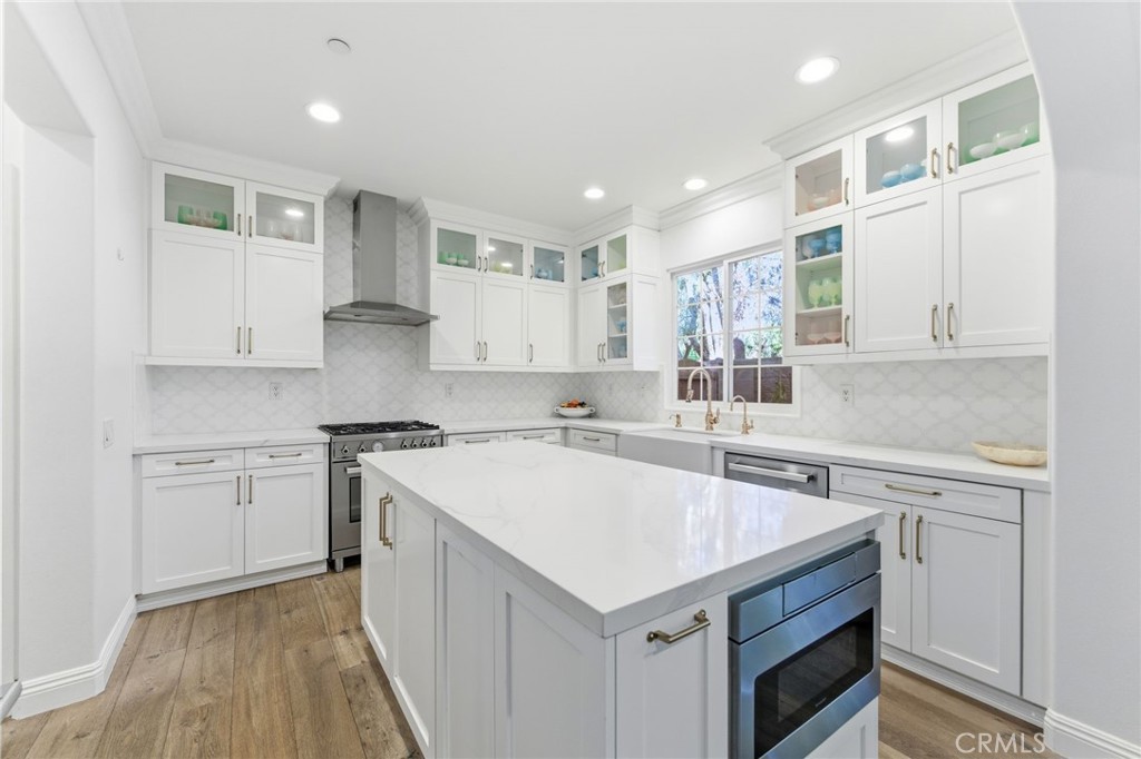 27 Gardenpath Irvine, CA 92603 - Photo 16 of 34 a kitchen with a sink stove and cabinets