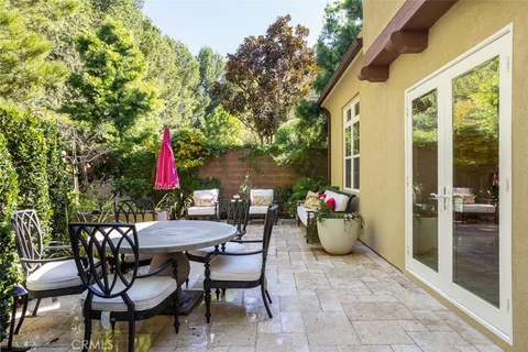 a view of a chairs and table in the patio