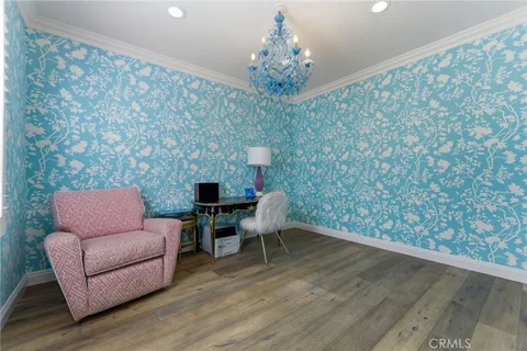 a view of a livingroom with furniture and wooden floor