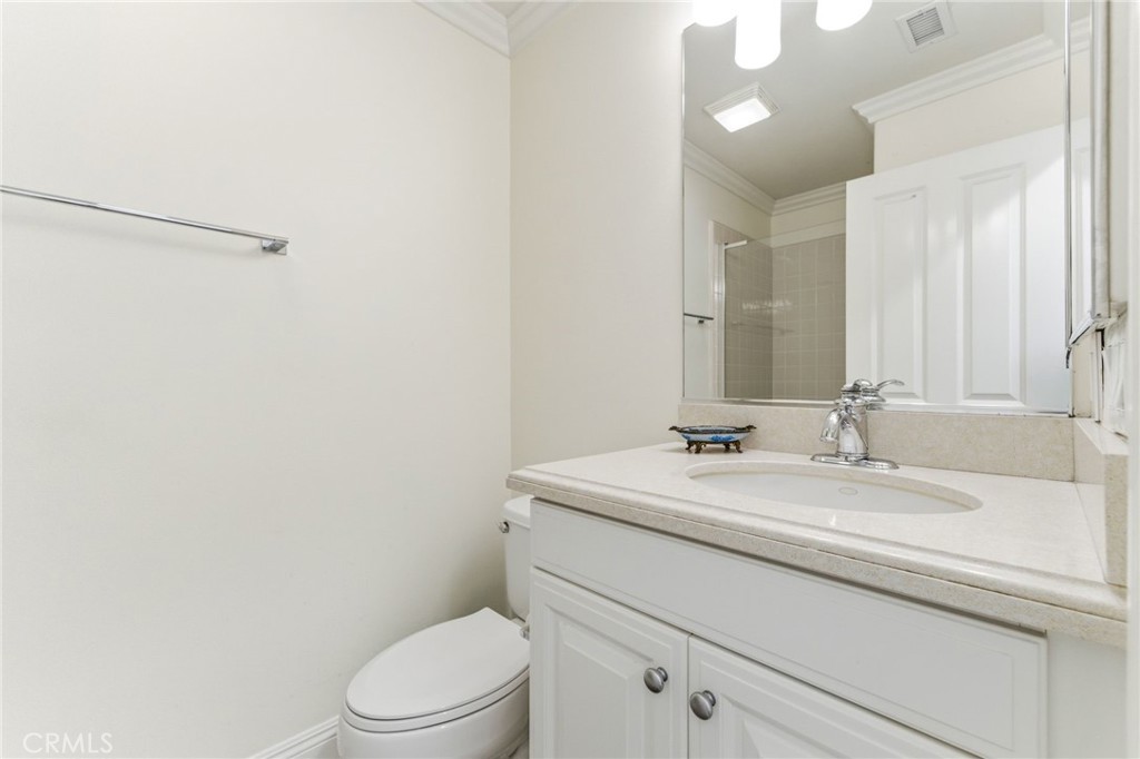 27 Gardenpath Irvine, CA 92603 - Photo 7 of 34 a bathroom with a sink a toilet and a mirror