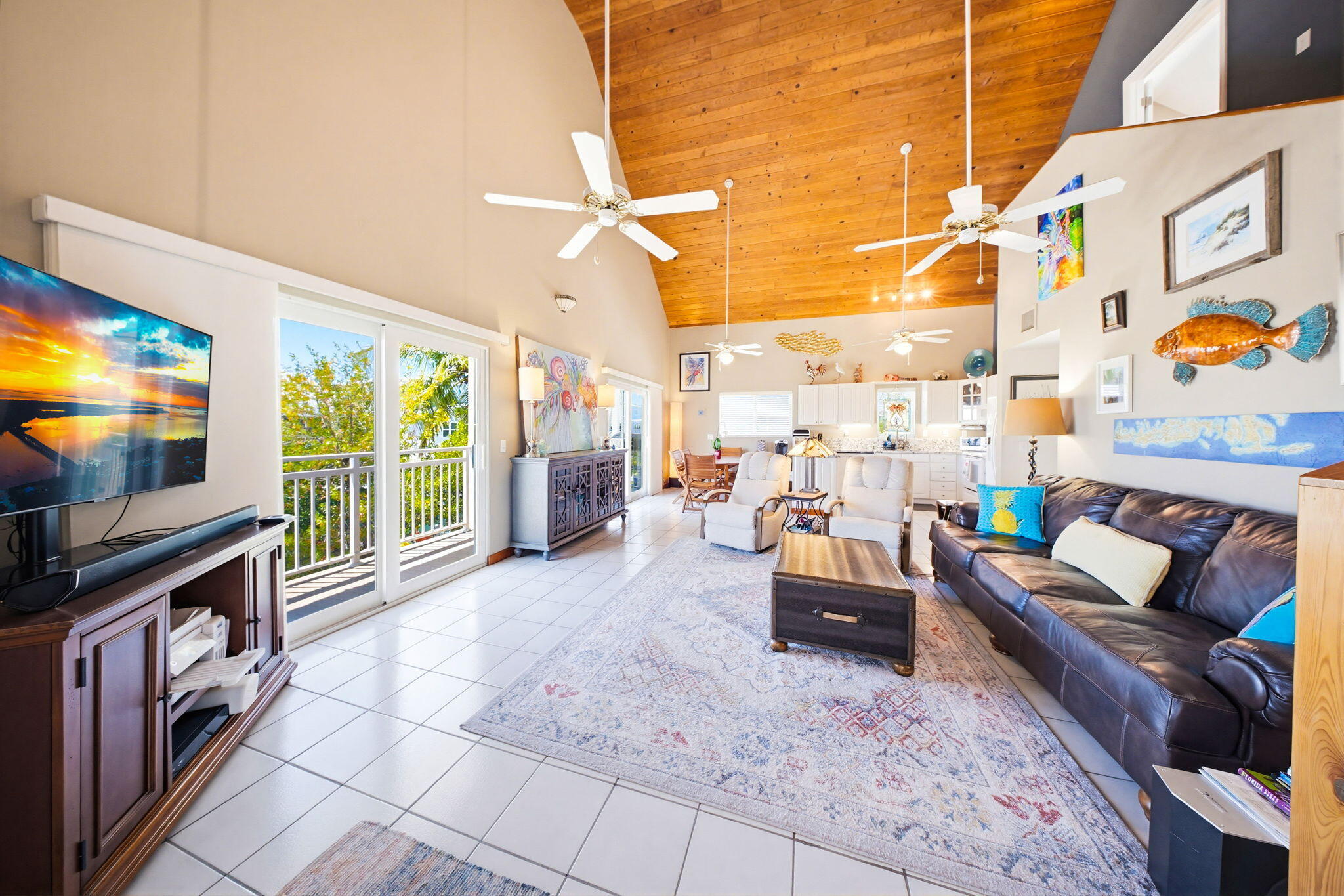 612 Blackbeard Road Summerland Key, FL 33042 - Photo 13 of 68 a living room with patio furniture and a flat screen tv