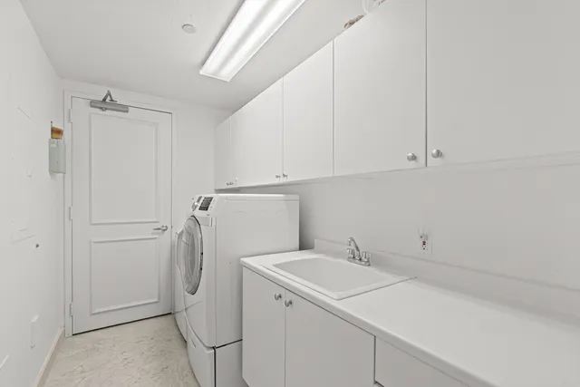 a swimming pool with outdoor seating and plants