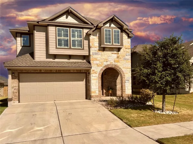 a front view of a house with yard