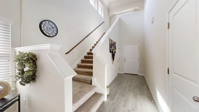 a view of entryway with wooden floor