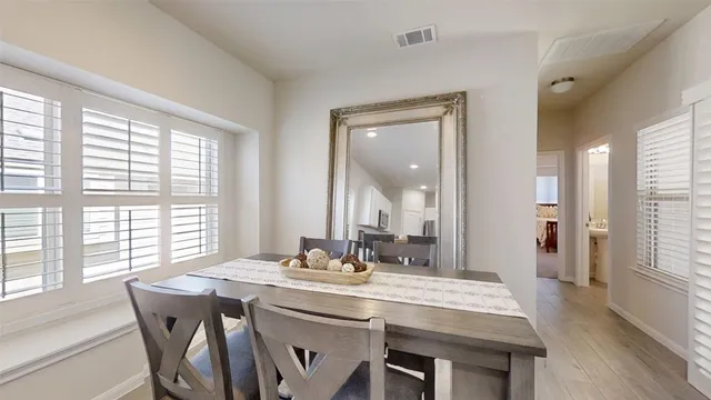 a view of a dining room with furniture and window