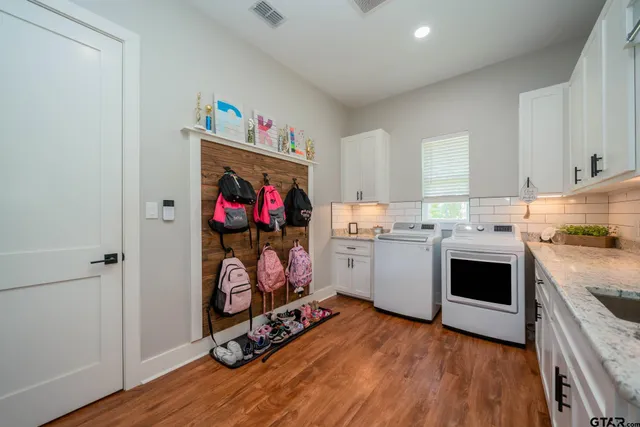 a kitchen with a sink cabinets and window
