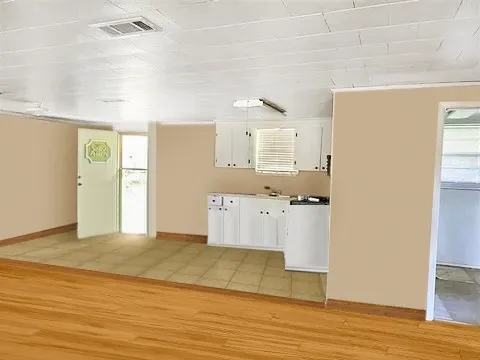 a view of kitchen with wooden floor