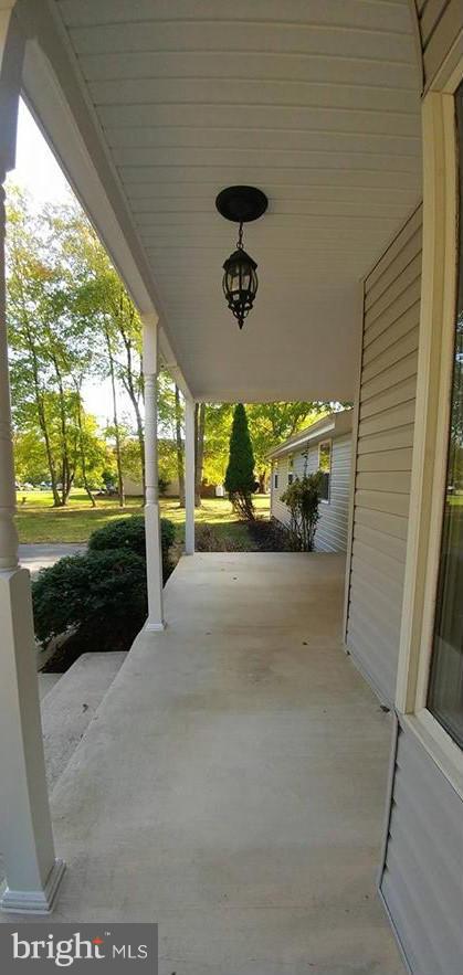 7435 Simms Landing Road Port Tobacco, MD 20677 - Photo 2 of 26 a view of a porch